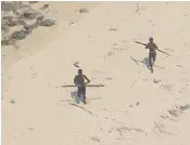  ??  ?? John Chau, right, had a tourist visa to enter the Andaman Islands and had made a number of visits. Tribesmen on North Sentinel Island preparing to fire arrows at an Indian coast guard helicopter, left
