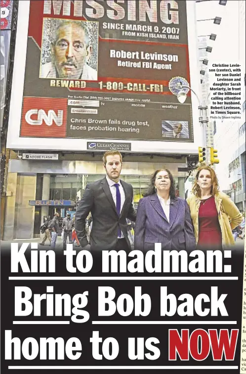  ?? Photo by Shawn Inglima ?? Christine Levinson (center), with her son Daniel Levinson and daughter Sarah Moriarty, in frontof the billboard calling attention to her husband, Robert Levinson, in Times Square.