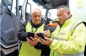  ?? ?? Above: Long serving driver Michael Makene (left) checking route details with Logistics Manager Neemia Seko.
Edward Narayan completes a pickup in Eden Terrace.