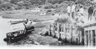  ??  ?? REMEMBERIN­G MARY JO: U.S. Sen. Edward M. Kennedy’s car is pulled from water on July 19, 1969. Mary Jo Kopechne’s body was found inside. Below, Kennedy addresses the nation on TV about the incident.