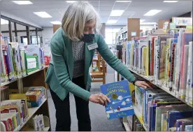  ?? PHOTOS BY BEN HASTY — MEDIANEWS GROUP ?? Janet Yost, the director of the Kutztown Community Library, reshelves a copy of “And to Think That I Saw It on Mulberry Street,” one of six books by Dr. Seuss that will no longer be published. Yost and other librarians in Berks said they will not pull the books off the shelves without proper procedures. “This can be used as a learning experience,” Yost says. “It opens people’s eyes as to how people felt at that time.”