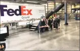  ??  ?? A ribbon-cutting ceremony takes place at FedEx’s new ground facility in Middletown.