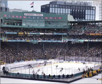  ?? (AP/Charles Krupa) ?? The Pittsburgh Penguins played the Boston Bruins in the 14th annual Winter Classic on Monday at Fenway Park in Boston. Boston won 2-1, getting two goals from Jake DeBrusk.
