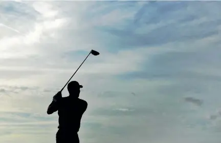  ?? PHOTO: GETTY IMAGES ?? Tiger Woods watches his tee shot on the 18th hole at the Hero World Challenge in the Bahamas.