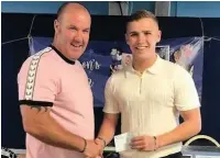  ??  ?? ●●Mason’s step-dad Paul O’Keese (left) with Bradley Gartland, who handed over a cheque from the Stephen Gartland Foundation