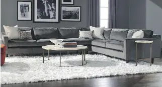  ?? PHOTOS (2): COURTESY OF ESSGO CARPETS ?? Those in the know suggest that homeowners, when decorating, start from the floor up, using the colours of a carpet to help determine the colour of couches, chairs and cushions. In this scene, for example, the white area rug sets off the dark wood...