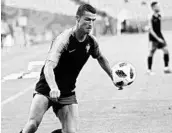  ?? FRANCISCO SECO/ASSOCIATED PRESS ?? Cristiano Ronaldo shoots the ball during Portugal's training on the eve of its Group B match against Spain.