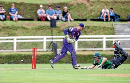  ?? PHOTO: GRANT MATTHEW/FAIRFAX NZ ?? Central Stags opener George Worker is run out by Canterbury keeper Cam Fletcher during the Super Smash match at Pukekura Park.