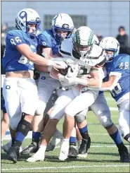  ?? MIKE CABREY— MEDIANEWS GROUP ?? Quakertown defenders try to tackle Pennridge’s Brennan Fisher on his carry during their game on Thursday.