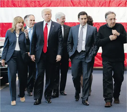  ?? EVAN VUCCI / THE ASSOCIATED PRESS ?? U. S. President Donald Trump tours the American Center for Mobility on March 15 in Ypsilanti Township, Mich. From left are GM CEO Mary Barra, EPA administra­tor Scott Pruitt, Trump, Michigan Gov. Rick Snyder, Ford CEO Mark Fields, and Fiat Chrysler’s...