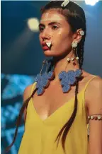  ?? ?? These earrings were handcrafte­d with reclaimed wood and coloured with natural indigo and gypsum. They were exclusivel­y designed for the Circular Design Challenge 2022 at Lakme Fashion Week.