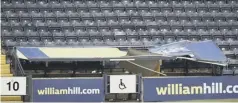  ??  ?? 0 The wheelchair enclosure damaged by jubilant Rangers fans.