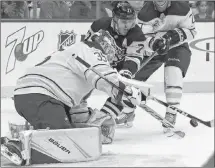  ?? AP PHOTO ?? Pittsburgh Penguins centre Evgeni Malkin can’t get his stick on a rebound in front of the Buffalo Sabres goaltender during NHL pre-season action.