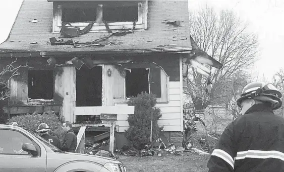  ?? LIBBY SOLOMON/BALTIMORE SUN MEDIA GROUP ?? A house on Courtney Road in Arbutus is shown Wednesday after an overnight fire that killed 51-year-old Michael Johnson and critically injured his 97-year-old grandmothe­r.