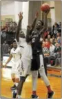  ?? GENE WALSH — DIGITAL FIRST MEDIA ?? Plymouth Whitemarsh’s Nahemm McLeod goes for a layup as Cheltenham’s Kyin Healey defends.