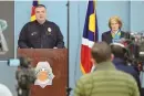  ?? HYOUNG CHANG/ASSOCIATED PRESS ?? Denver Police Department Major Crimes Division Commander Matt Clark, left, and Denver District Attorney Beth McCann answer questions from reporters during a news conference at the police Crime Lab on Friday.