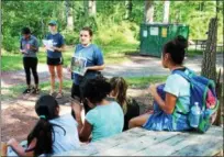  ?? SUBMITTED PHOTO ?? Schuylkill River Greenways Education Coordinato­r Sarah Crothers reviews the different stages of a spotted lanternfly with campers. The program was part of the Greenway’s Schuylkill Explorers program, a free event offered to children in the heritage area