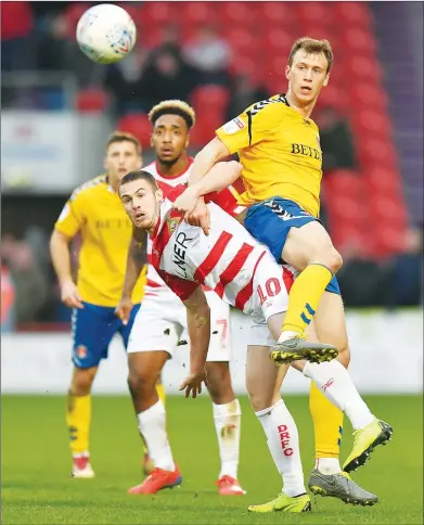  ??  ?? CONFRONTAT­ION: Charlton’s Krystian Bielik, right, takes on Doncaster’s Tommy Rowe