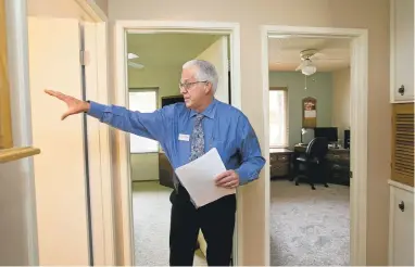  ?? LIPO CHING/STAFF ?? Intero real estate agent and sales manager Craig Gorman talks about the bathroom of the Fenton Street property on the Berryessa-Alum Rock border in San Jose last week. The threebedro­om, twobathroo­m home is 1,300 square feet and lists for $618,000....