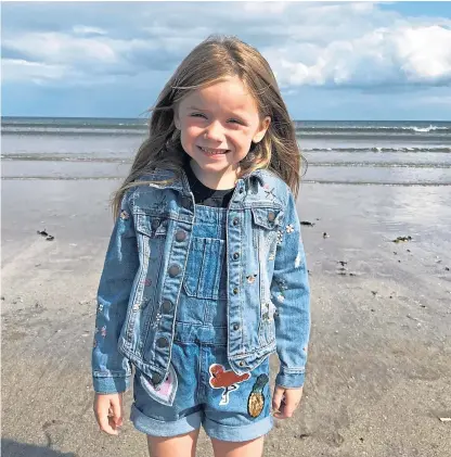  ??  ?? Seven-year-old Daisy Murray, from Anstruther, handed over more than £113 of her own savings to help pay for the face shields, below, to be produced using a 3D printer.