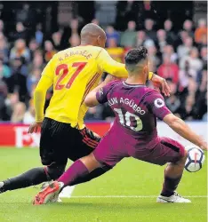  ??  ?? ARGIE BARGY Aguero holds off Kabasele to net his third
