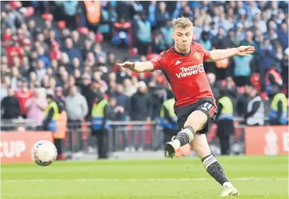  ?? Picture: Getty Images ?? CALM HEAD. Manchester United’s Rasmus Hojlund slots the winning penalty in the shoot-out of their FA Cup semifinal against Coventry City at Wembley yesterday.
