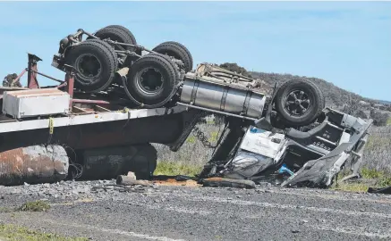  ?? Picture: Kevin Farmer ?? SAD DAY: A man died after his truck rolled on the New England Highway at East Greenmount yesterday. He was the 38th person to be killed in a heavy vehicle crash on Queensland’s roads this year.