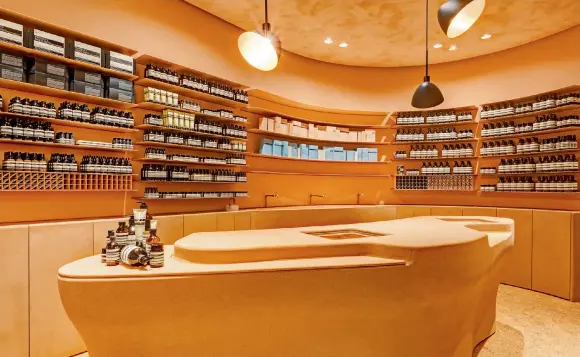  ?? Photos courtesy of Aesop ?? Aesop’s store in the IFC mall was designed by local design studio Mlkk with a eucalyptus and cork-lined interior featuring a curvilinea­r pebble wash counter and shelving inspired by traditiona­l craftsmans­hip.