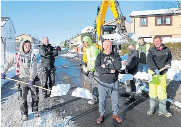  ??  ?? “BRILLIANT EFFORT”: Local resident Jim Mochan, centre, with property developer Eddie Wighton, second from left, and his “community-spirited” team from Invertay Homes – Kerry Gray, Johnnie Whelan, Gareth Hutchison, Grant Tanbini and Michael Pratt – who dug out snowbound residents in the Dales area of Dundee. Pictures by Gareth Jennings.