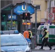  ??  ?? Police guard the scene of a reported shooting at a Starbucks cafe near ‘Checkpoint Charlie’ in Berlin, Germany