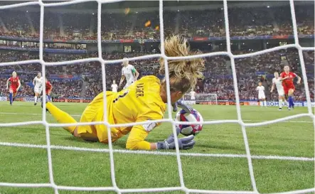  ?? AP PHOTO/ALESSANDRA TARANTINO ?? United States goalkeeper Alyssa Naeher saves a penalty kick taken by England’s Steph Houghton during a Women’s World Cup semifinal on Tuesday at Stade de Lyon in France. The top-ranked Americans won 2-1 and will face the Netherland­s for the title on Sunday.