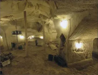  ?? PHOTOS BY BROOKE LEFFERTS, THE ASSOCIATED PRESS ?? An undergroun­d cave in the National Park of Beit Guvrin, home of the Dig for a Day program run by Israel’s Archaeolog­ical Seminars Institute. Participan­ts get two buckets: one for significan­t finds and one for junk, as they sift the ground, looking for...