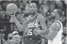  ?? KLUCKHOHN/USA TODAY SPORTS BRUCE ?? Suns forward Kevin Durant looks to pass against Timberwolv­es guard Mike Conley on Sunday in Minneapoli­s.