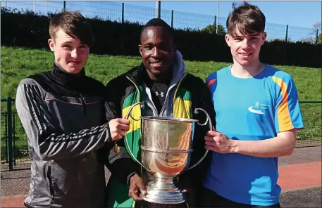  ??  ?? Tralee Harriers athletes, from left, Cillian Griffin, Travane Morrison and Luke O’Carroll with the Quill Cup