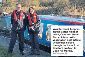  ?? PHOTO SUPPLIED ?? Voluntary lock keepers on the Seend flight of locks, Clive and Marie Perry pictured with vaccinatio­n boat Litania which they helped through the locks from Bradford on Avon to Caen Hill Marina.