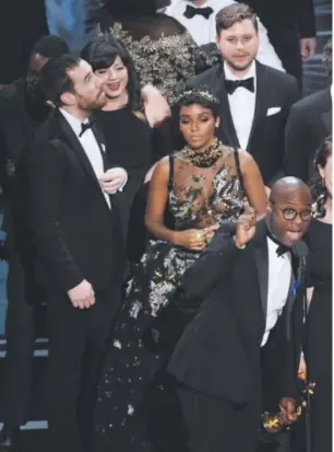  ?? Chris Pizzello, Invision via The Associated Press ?? Director Barry Jenkins, foreground left, and the cast accept the award for best picture for