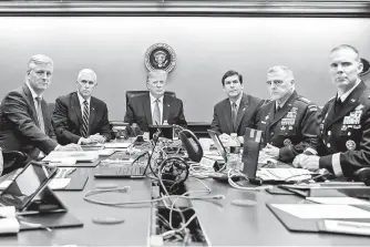  ??  ?? US President Donald Trump (center), US Vice President Mike Pence (second from left), US Secretary of Defense Mark Esper (third from right), along with members of the national security team, watch as US Special Operations forces close in on IS leader Abu Bakr al-Baghdadi in the Situation Room of the White House in Washington. — Reuters