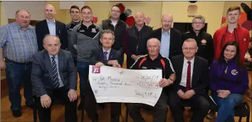 ??  ?? Pat Mannix (Banteer/Lyre GAA) accepts a €20,000 prize won in the Cork GAA Clubs Draw presented by Richard Murphy, Cork GAA Clubs Draw in the presence of Pearse Murphy, Chairman, Cork GAA Clubs Draw; Diarmuid Gowen, Treasurer, Cork Co. Board, Tony McAulliffe, Liam Buckley, Duhallow Board and club members at a presentati­on in Lyre Hall. Photo: John Tarrant