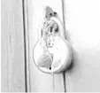  ?? — AFP photo ?? An amulet is seen hanging from a padlock at the house of the eight-year-old girl, who was raped and murdered, at Rasana village in Kathua district of Jammu.