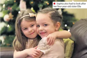  ??  ?? ■ Sophia also had to look after her four-year-old sister Ella