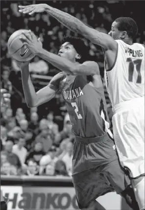  ?? AP/AL GOLDIS ?? Louisiana-Lafayette guard Elfrid Payton (2) shoots against Michigan State guard Keith Appling (11) during the first half of Sunday’s game in East Lansing, Mich. Payton led Louisiana-Lafayette with 20 points, while Appling had 19 for Michigan State....