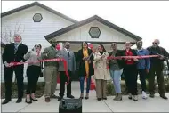  ?? ELIZA GREEN / THE CALIFORNIA­N ?? Government representa­tives stand for a ribbon-cutting Thursday for Benton Park Cottages, a new affordable housing facility developed by the Housing Authority of the County of Kern and located on Hughes Lane.