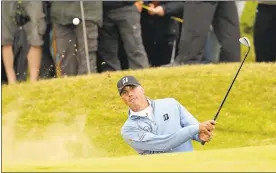  ?? ALASTAIR GRANT — ASSOCIATED PRESS ?? Matt Kuchar plays out of the bunker on the 16th hole during the second round. He shot a 1-over 71as one of the early finishers and trails Jordan Spieth by two.