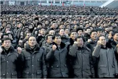  ?? JON CHOL JIN/THE ASSOCIATED PRESS ?? North Koreans attend a rally in the Kim Il Sung Square, vowing to carry through the tasks set forth by Kim Jong Un in his New Year address in Pyongyang, North Korea, on Thursday. The U.S. and South Korea have agreed to postpone military exercises until...
