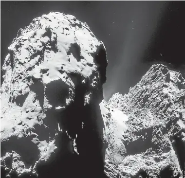  ?? Photo: ESA ?? Impressive: A new image from the European Space Agency’s Rosetta craft shows a towering cliff on Comet ChuryumovG­erasimenko.