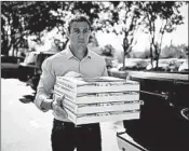  ?? SANDY HUFFAKER/GETTY ?? Rep. Duncan Hunter takes pizzas to campaign workers. Hunter won despite facing federal charges of wire fraud.