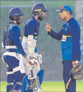  ?? AFP ?? Sri Lanka batting coach Thilan Samaraweer­a (right) has a chat with Upul Tharanga (centre) and Kusal Mendis during a training session in Dubai ahead of their match against Bangladesh.