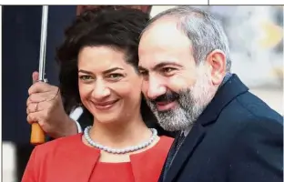  ?? — Reuters ?? Pushing for change: A file photo of Pashinyan with his wife Anna Hakobyan. Analysts say Pashinyan sought new elections while he is at the peak of his popularity.