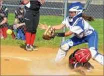  ?? KYLE MENNIG — ONEIDA DAILY DISPATCH ?? Proctor’s Marcella Seaton slides into home as Oneida catcher Emily Marshall fields the throw in from right field. Seaton was out on the play.