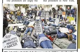  ?? “Die-in” at New York Stock Exchange protests GOP tax plan Tuesday. ??